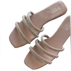 Simmi London flat sandals with embellished straps in beige.
